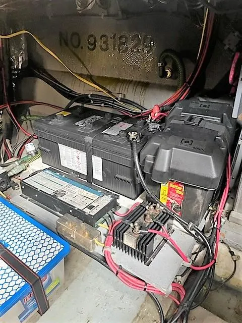Slide: The Image of Battery compartment of a 1987 Tollycraft Sundecker Diesel boat with wiring and components. - 36