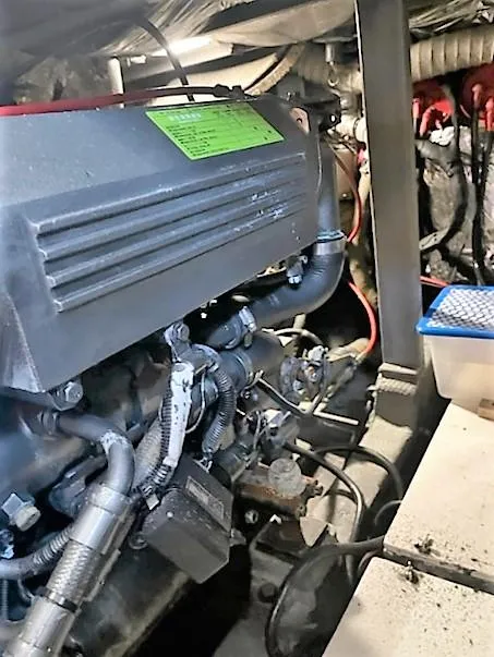 Slide: The Image of 1987 Tollycraft Sundecker Diesel engine compartment with visible components and wiring. - 38