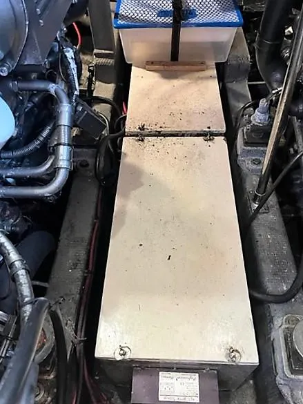 Slide: The Image of Engine compartment of 1987 Tollycraft Sundecker Diesel boat, showing mechanical components. - 39