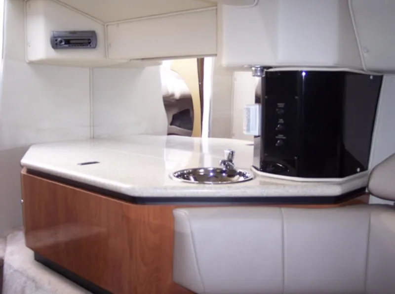 Slide: The Image of 2007 Fountain 38 Lightning boat interior with kitchenette and sink. - 11