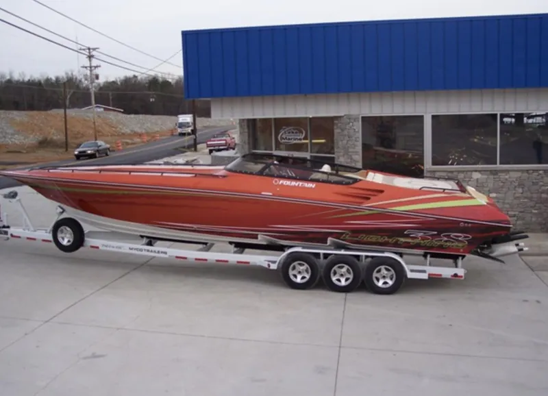 Slide: The Image of 2007 Fountain 38 Lightning speedboat on a trailer outside a building. - 4