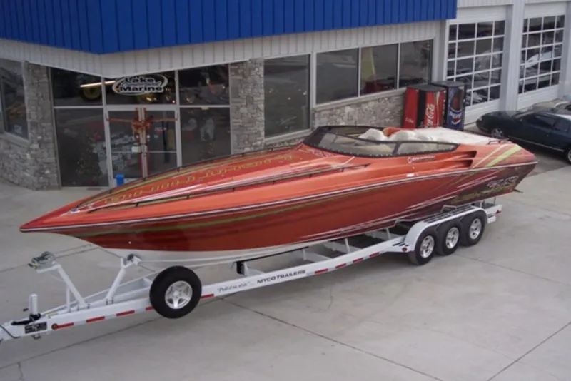 Slide: The Image of 2007 Fountain 38 Lightning speedboat on a trailer outside a marine dealership. - 7
