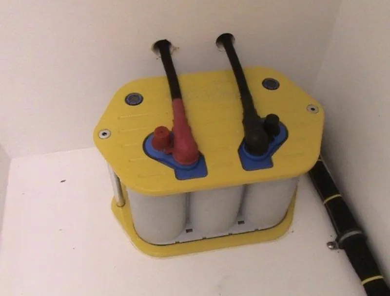 Slide: The Image of 2006 MTI 44 boat battery with yellow top and connected cables. - 10