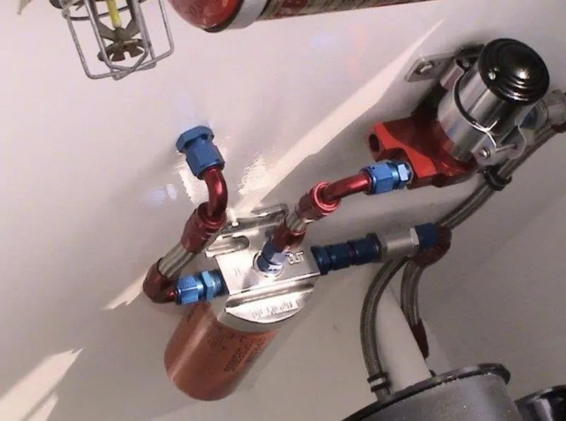 Slide: The Image of 2006 MTI 44 engine compartment with fuel filter and fittings. - 15