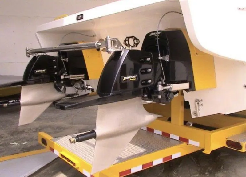 Slide: The Image of 2006 MTI 44 boat with dual Mercury outboard engines on a yellow trailer. - 5