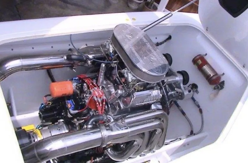 Slide: The Image of 2006 MTI 44 boat engine compartment with visible engine components. - 9