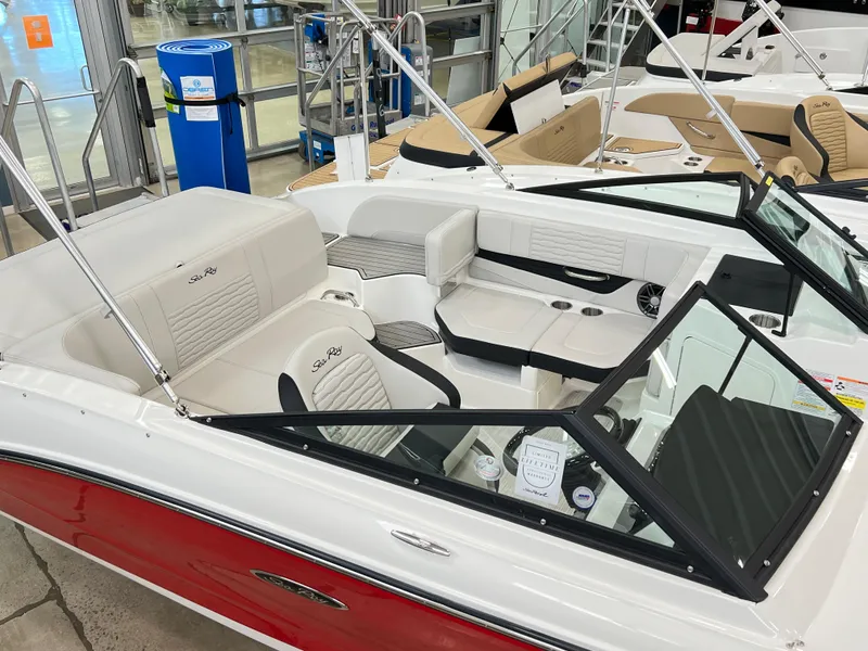 Slide: The Image of 2023 Sea Ray SPX 190 boat interior with white and black seating. - 1