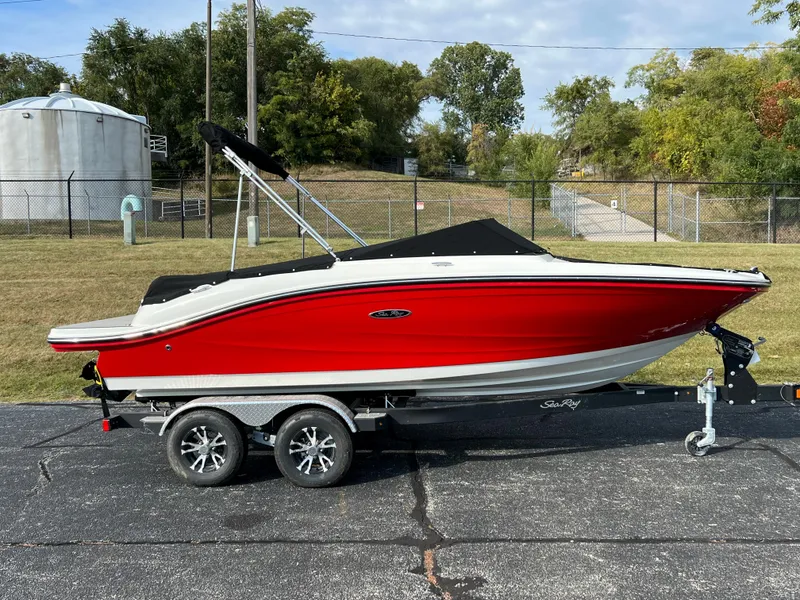 Slide: The Image of 2023 Sea Ray SPX 190 boat on a trailer, red and white exterior. - 10