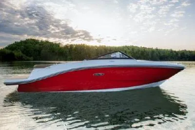 Slide: The Image of 2023 Sea Ray SPX 190 boat on calm lake at sunset. - 12