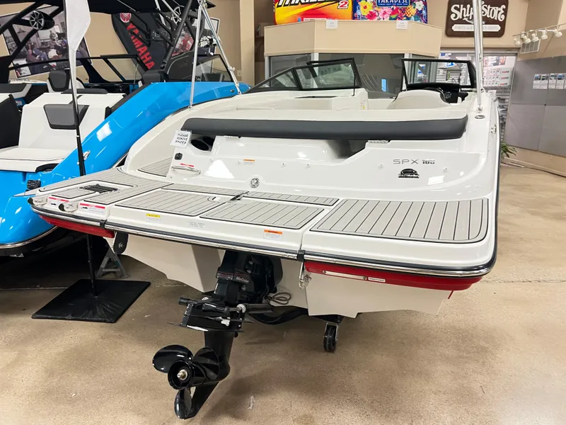 Slide: The Image of 2023 Sea Ray SPX 190 boat displayed indoors, rear view. - 2