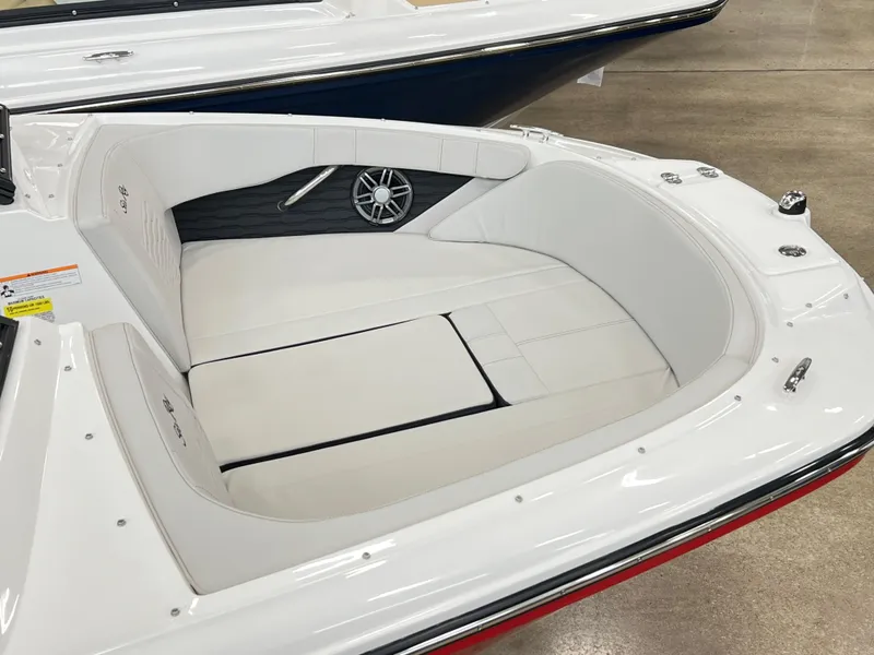 Slide: The Image of 2023 Sea Ray SPX 190 boat interior with white cushioned seating. - 5