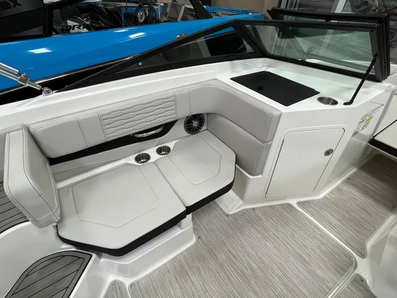 Slide: The Image of 2023 Sea Ray SPX 190 boat interior with white seating and modern design. - 6