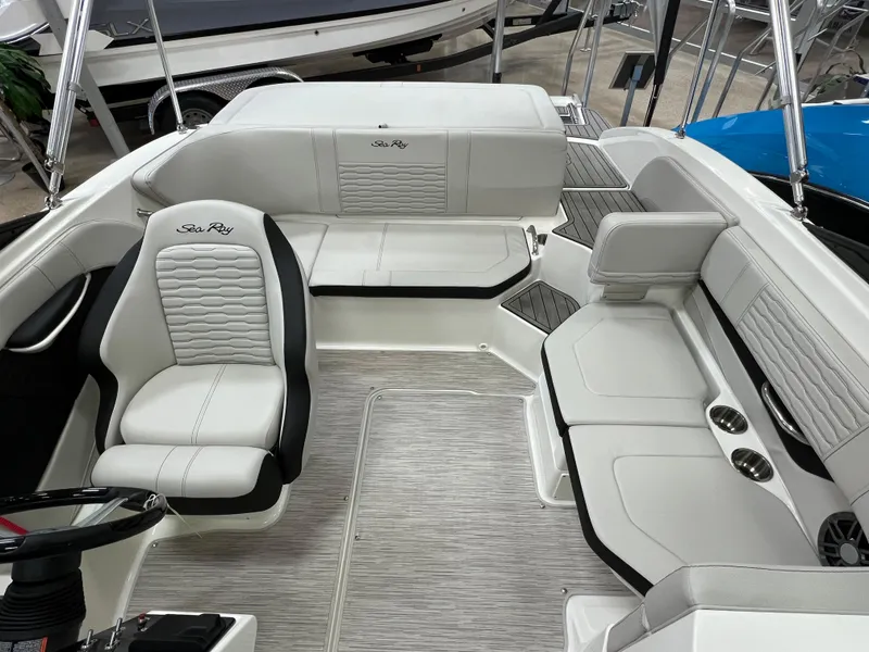 Slide: The Image of 2023 Sea Ray SPX 190 boat interior with white and black seating. - 8