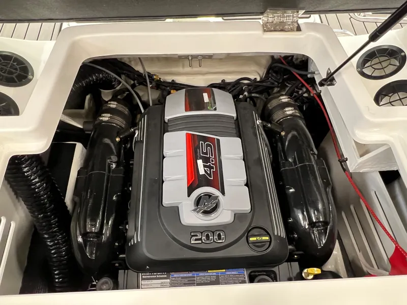 Slide: The Image of 2023 Sea Ray SPX 190 boat engine compartment with 4.5L 200 HP MerCruiser engine. - 9