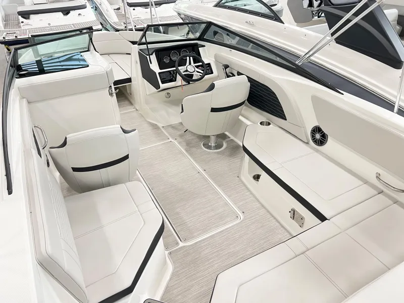 Slide: The Image of 2023 Sea Ray SPX 230 boat interior with modern seating and sleek design. - 5