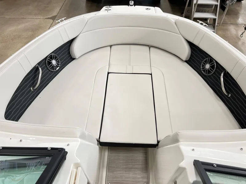 Slide: The Image of 2023 Sea Ray SPX 230 boat interior with white seating and black accents. - 7