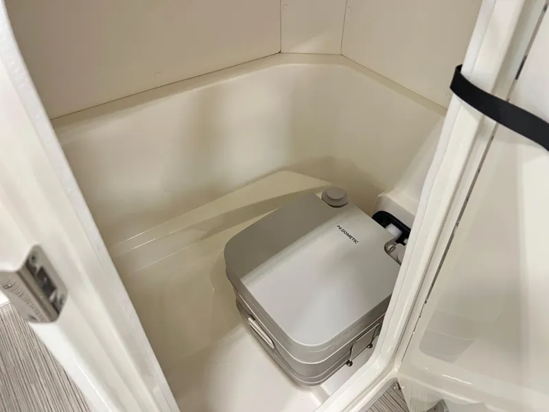 Slide: The Image of Compact bathroom with portable toilet in 2023 Sea Ray SPX 230 boat. - 8
