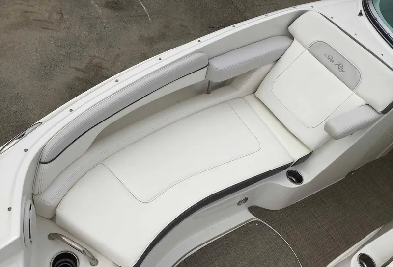 Slide: The Image of 2012 Sea Ray 26 Bow Rider boat with white seating and clean deck. - 7