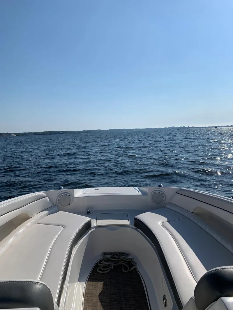 Slide: The Image of 2012 Sea Ray 26 Bow Rider on open water, clear sky, and calm sea. - 8