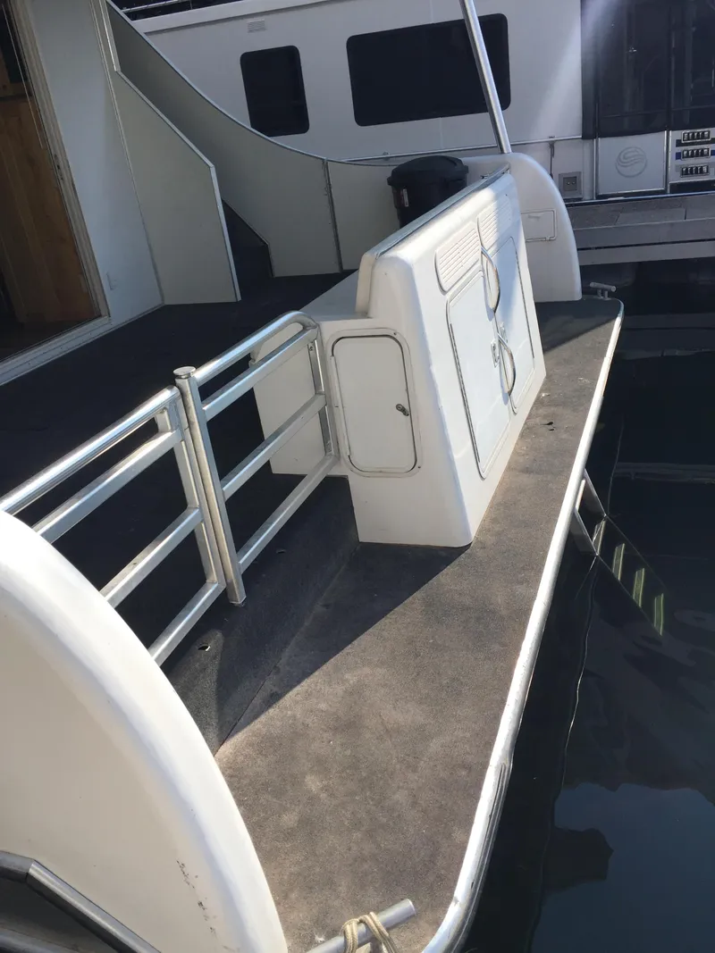 Slide: The Image of Custom 2005 yacht, The Entourage Shares #21, 33, and 40, docked with open hatch. - 15
