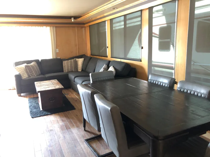 Slide: The Image of Modern living and dining area in a 2005 Custom Entourage Shares houseboat. - 25