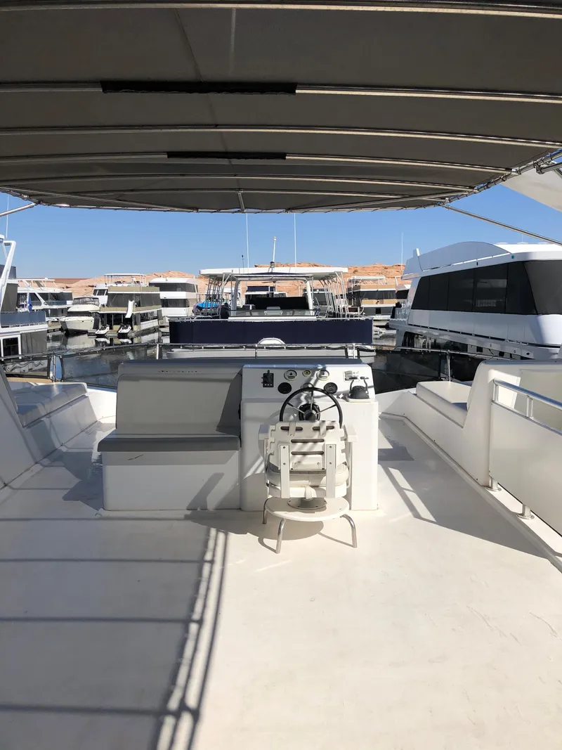 Slide: The Image of Luxury yacht The Entourage Shares #21,33 and 40 2005 model docked at marina. - 4