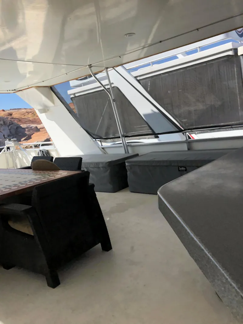 Slide: The Image of Luxurious yacht deck with seating area, Custom model The Entourage Shares #21,33 and 40 (2005). - 5