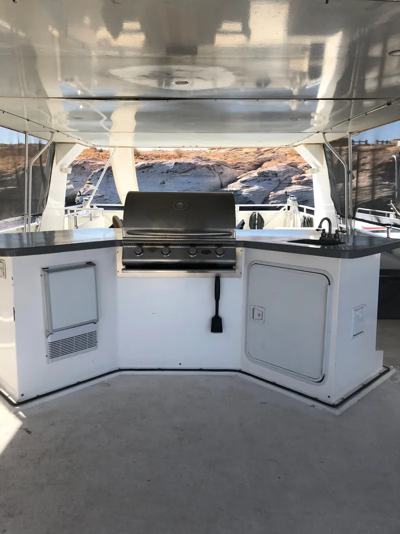 Slide: The Image of Outdoor kitchen on a 2005 Custom boat model The Entourage Shares #21,33 and 40. - 6