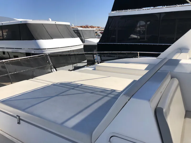 Slide: The Image of Luxury yacht The Entourage Shares #21,33 and 40 2005 model, docked with other boats. - 7