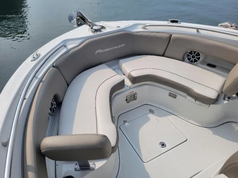 Slide: The Image of 2023 Finseeker 220 boat with beige seating and sleek design. - 11