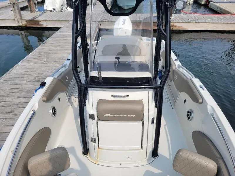 Slide: The Image of 2023 Finseeker 220 boat docked, featuring spacious seating and modern design. - 13