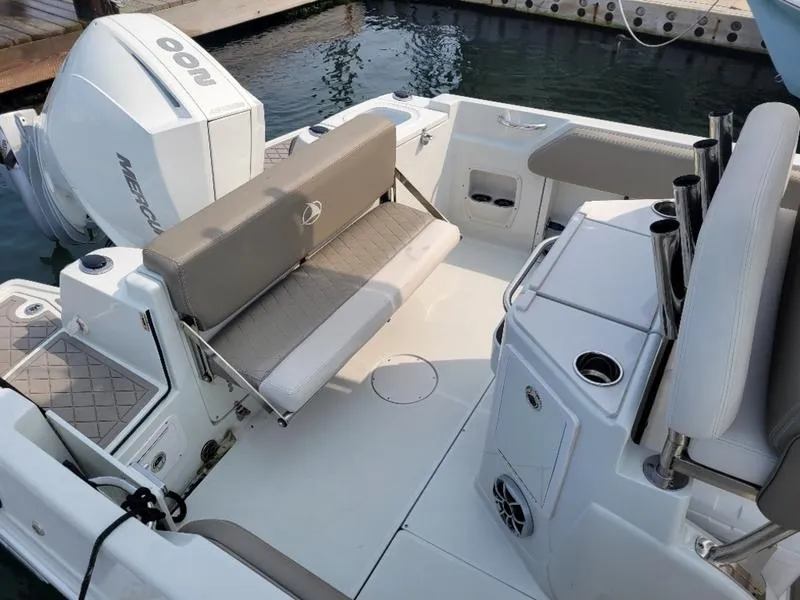 Slide: The Image of 2023 Finseeker 220 boat interior with seating and Mercury outboard engine. - 15