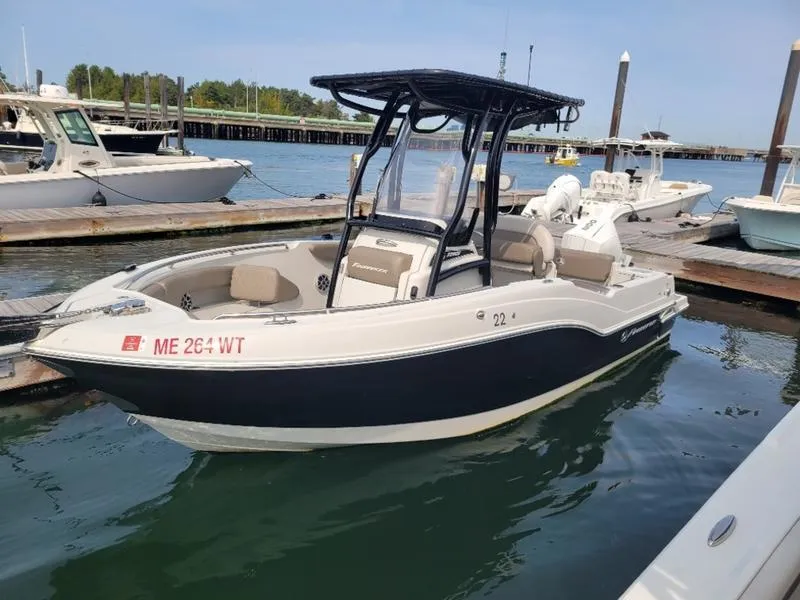 Slide: The Image of 2023 Finseeker 220 boat docked at marina, featuring sleek design and modern amenities. - 16