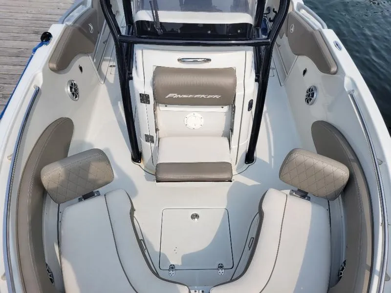 Slide: The Image of 2023 Finseeker 220 boat interior with beige seating and modern design. - 18