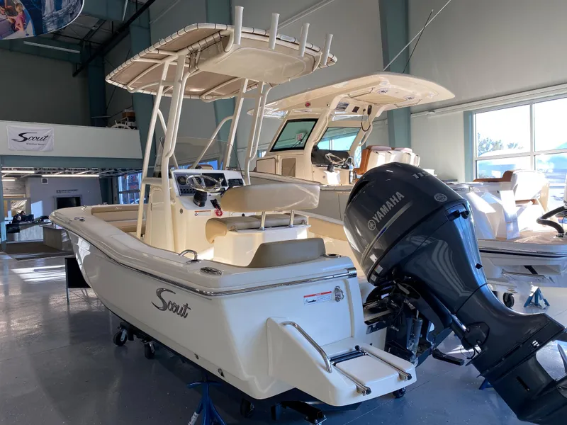 Slide: The Image of 2024 Scout 195 Sportfish boat with Yamaha outboard motor in showroom. - 1