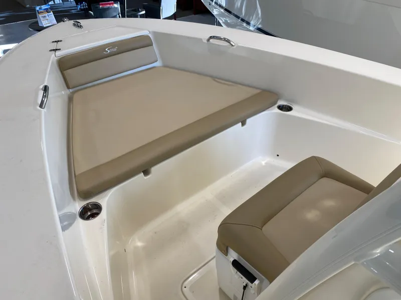 Slide: The Image of 2024 Scout 195 Sportfish boat interior with beige seating and white deck. - 3