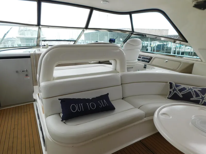 Slide: The Image of Interior of a 2004 Sea Ray 600 Sun Sport yacht with white seating. - 11