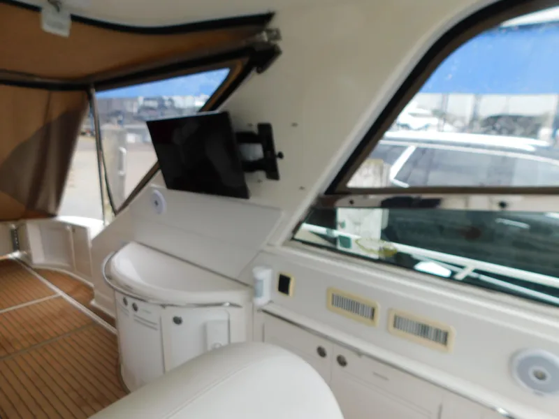 Slide: The Image of Interior of a 2004 Sea Ray 600 Sun Sport yacht with TV and wood flooring. - 15