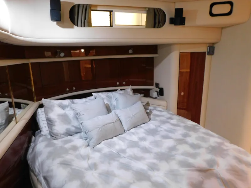 Slide: The Image of Luxurious bedroom in a 2004 Sea Ray 600 Sun Sport yacht. - 30