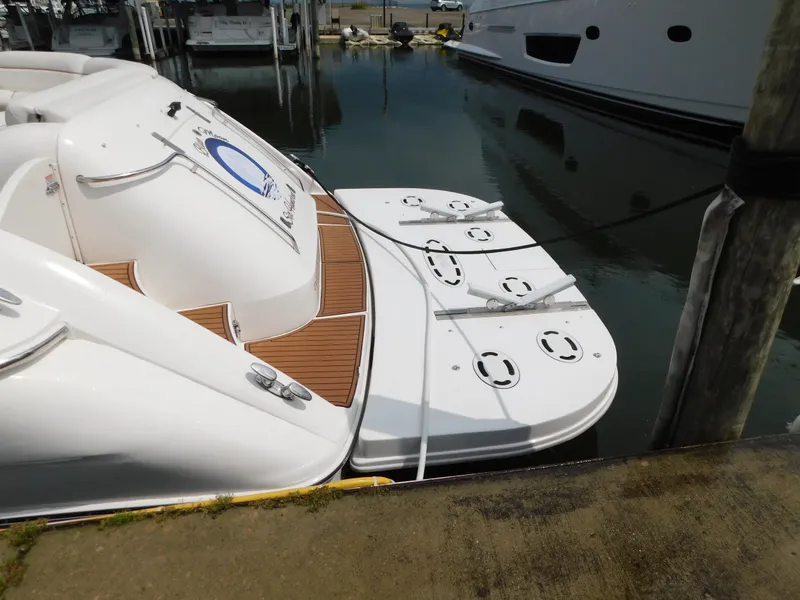 Slide: The Image of Rear view of a 2004 Sea Ray 600 Sun Sport yacht in harbor. - 4