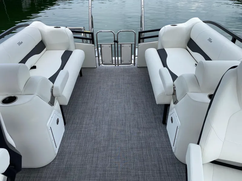 Slide: The Image of 2024 JC Neptoon Sport 23TT DSL pontoon boat interior with white and gray seating. - 17