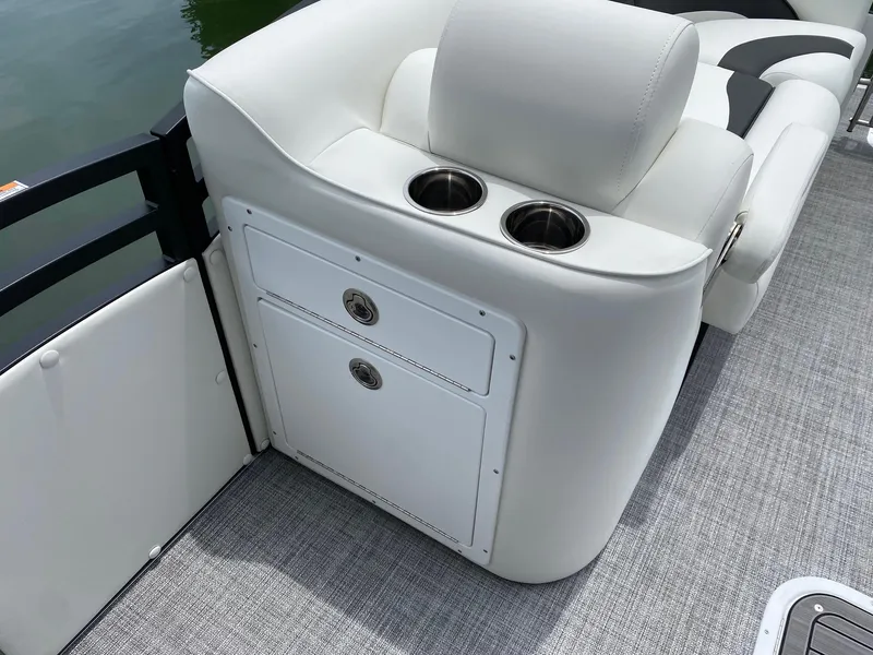 Slide: The Image of 2024 JC Neptoon Sport 23TT DSL boat interior with white seating and cup holders. - 7