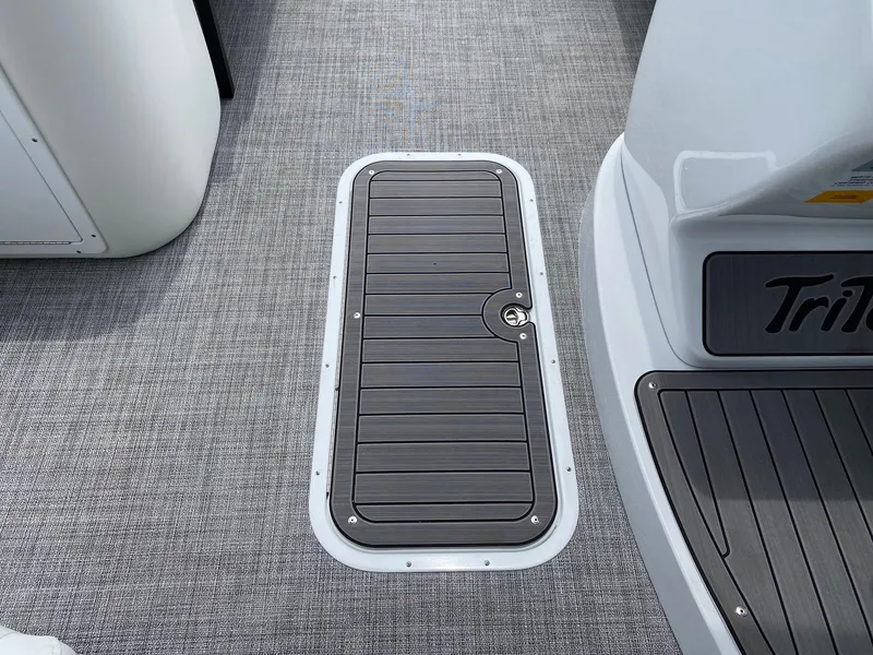 Slide: The Image of 2024 JC Neptoon Sport 23TT DSL boat deck with storage hatch. - 16