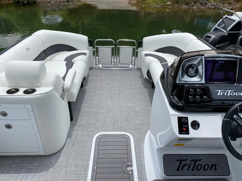 Slide: The Image of 2024 JC Neptoon Sport 23TT DSL pontoon boat interior with seating and control console. - 6