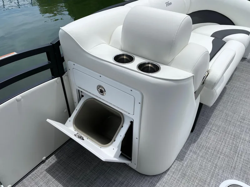 Slide: The Image of 2024 JC Neptoon Sport 23TT DSL boat with white seating and built-in storage. - 8