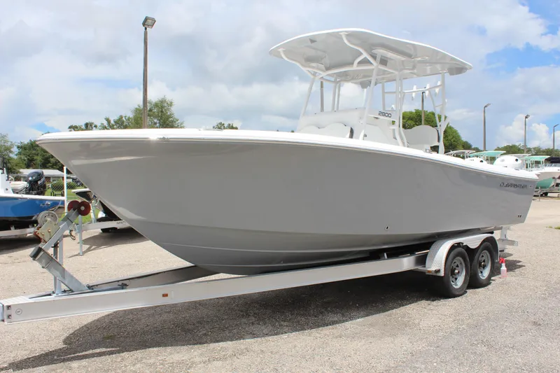 The Image of 2024 Clearwater 2800 boat on a trailer in a parking lot. - 1