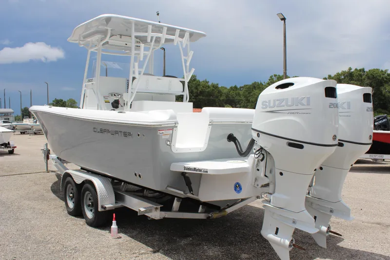 Slide: The Image of 2024 Clearwater 2800 boat with dual Suzuki engines on a trailer. - 3