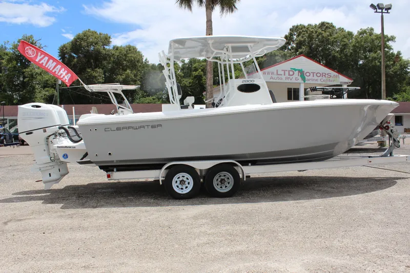 Slide: The Image of 2024 Clearwater 2800 boat on a trailer with Yamaha outboard motor. - 5