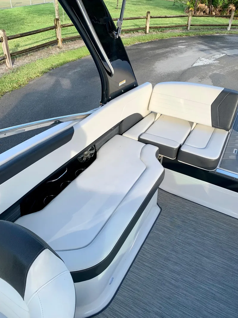 Slide: The Image of 2016 Regal Fastrac boat interior with white and black seating. - 13