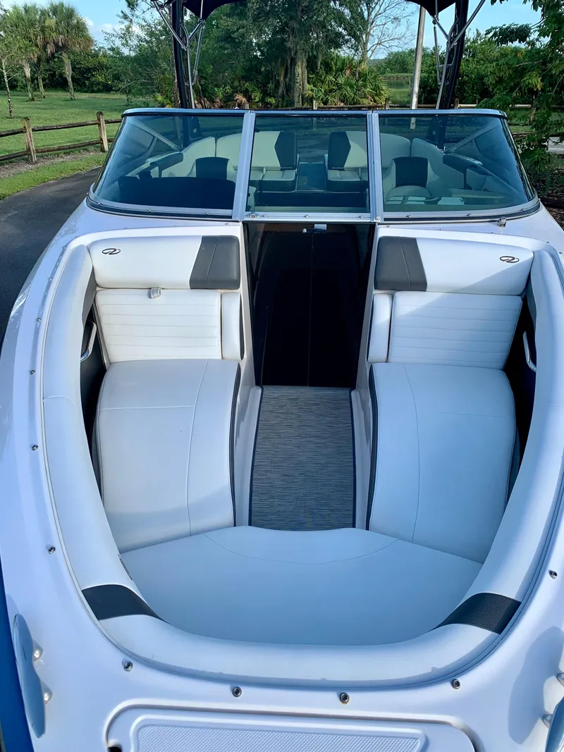 Slide: The Image of 2016 Regal Fastrac boat with white and gray interior seating. - 15